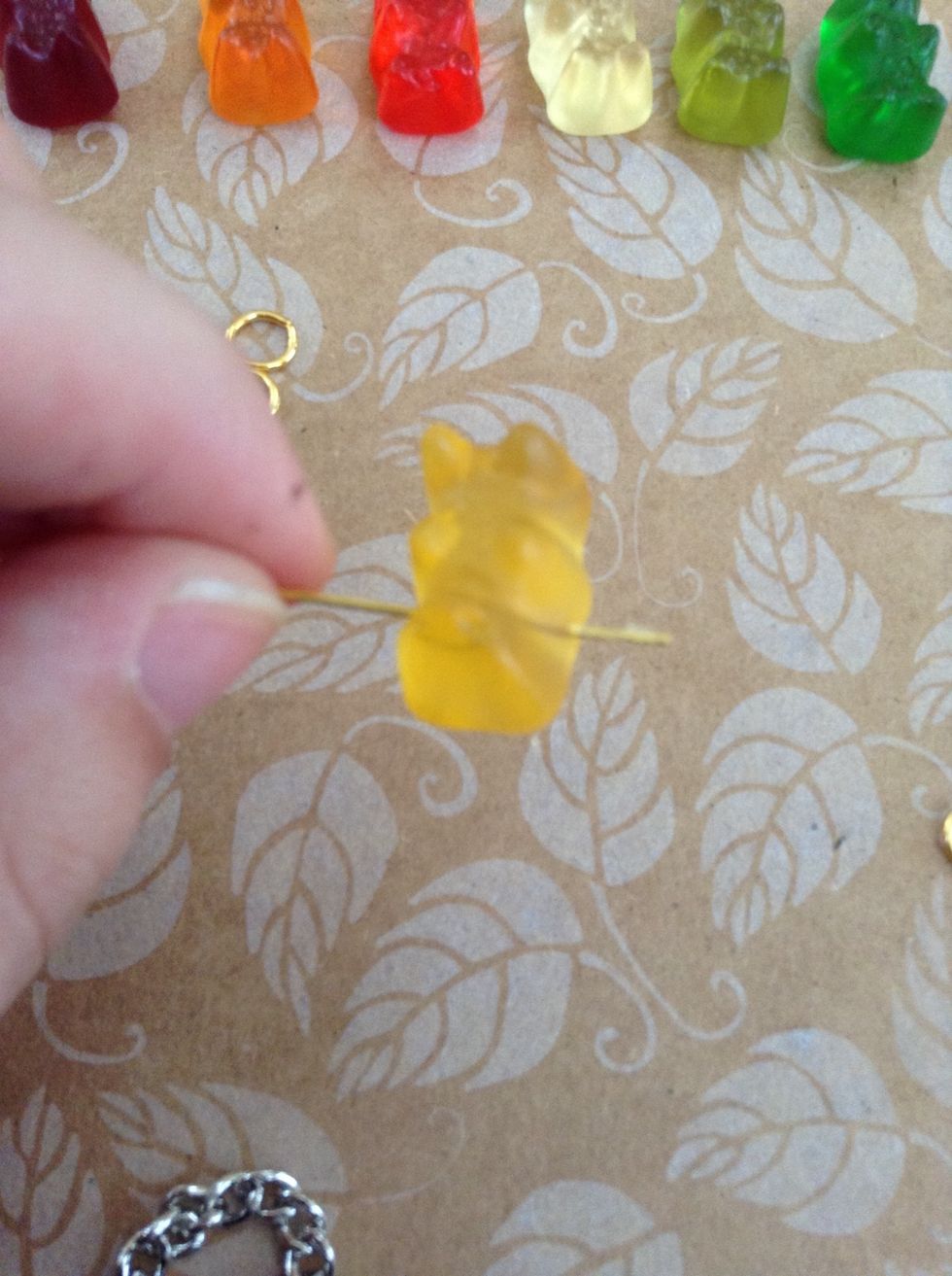 Stick a needle through the center so the bear can harden