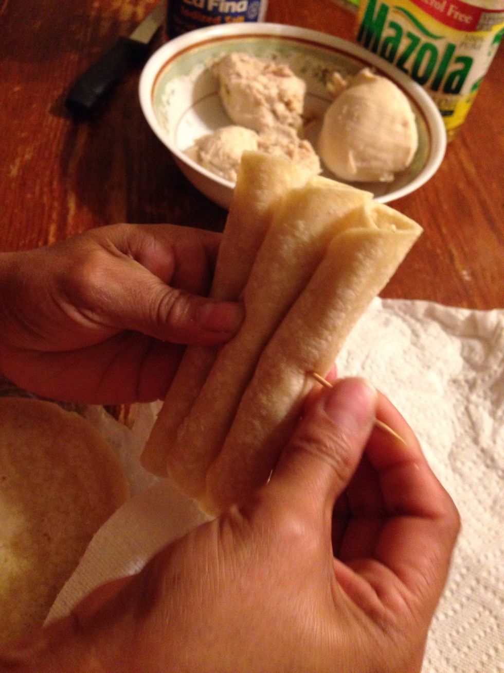 Stick a toothpick in 3 Flautas to cook easier.