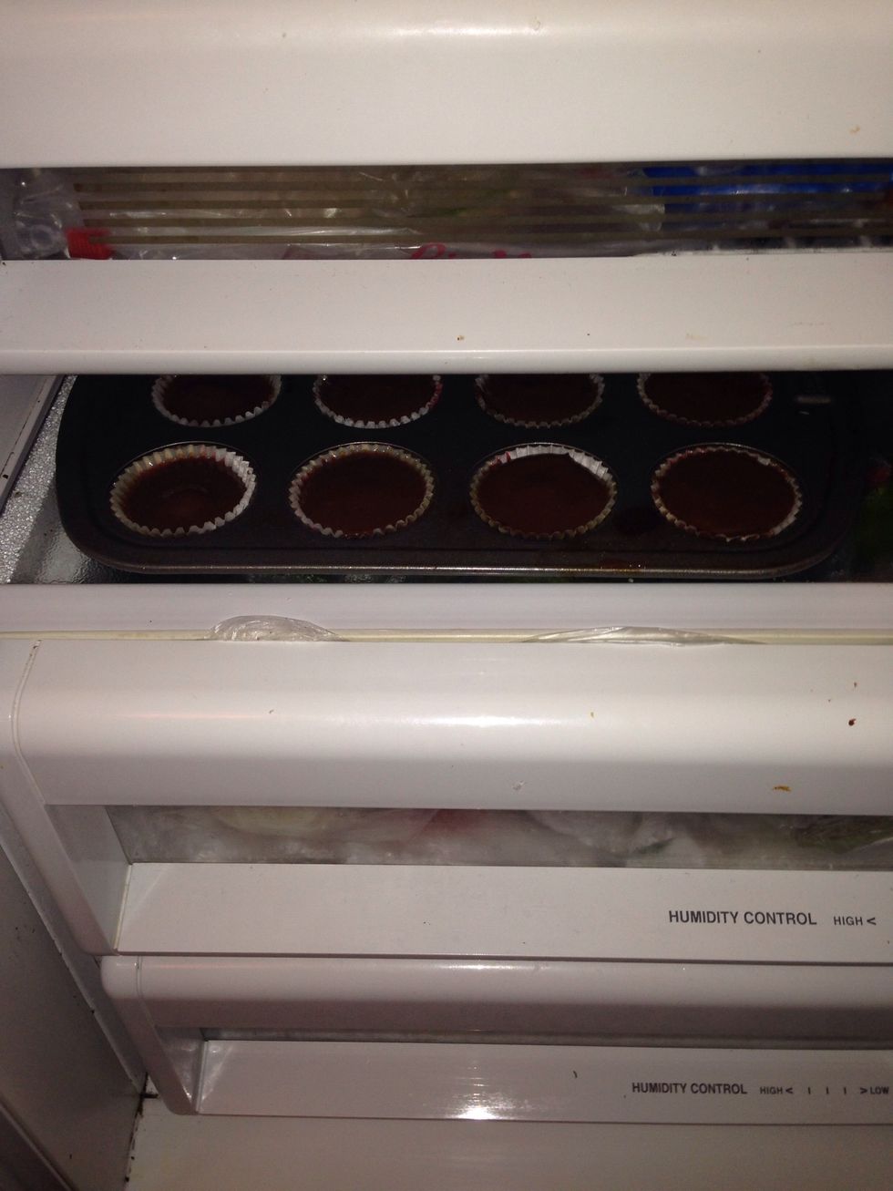 Stick 'em in the fridge or the freezer if you're in a hurry. Then all you gotta do is wait until the chocolate re hardens. Then you pop them bad boys right in your mouth!