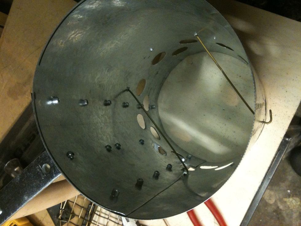 Stick hanger through the outer holes and bend the ends. This is going to support your screen. Place the screen in chimney.