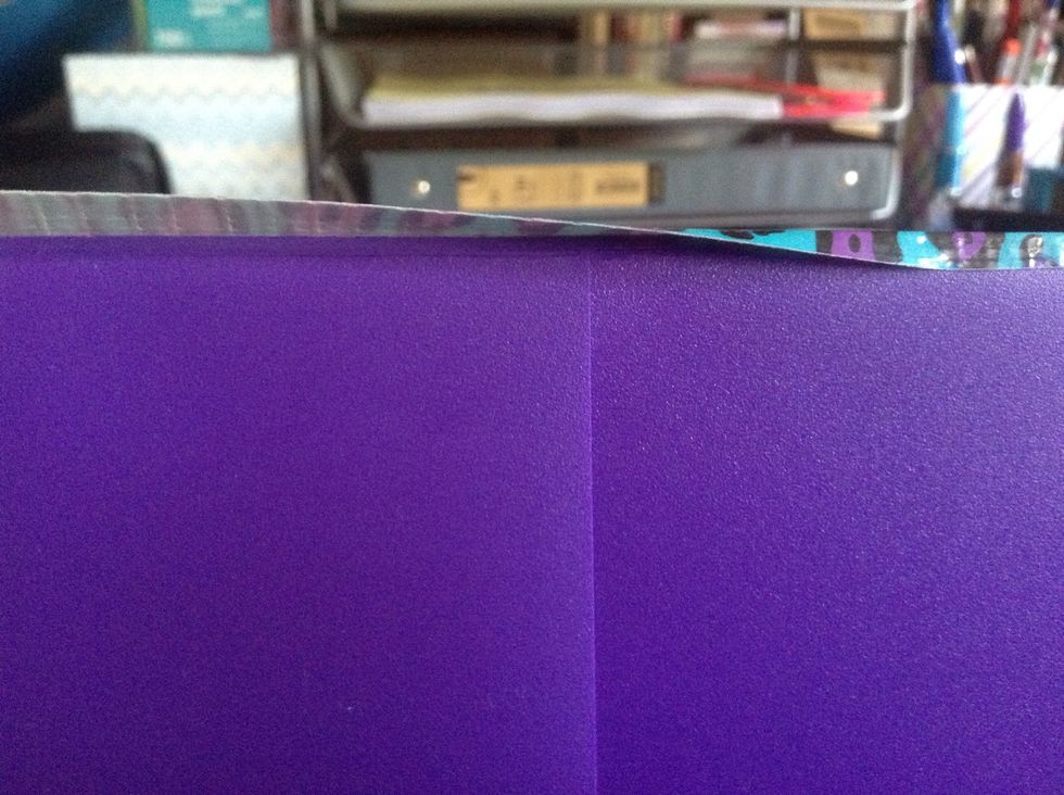 Stick it down like you did the ends of the tape on the sides, using your fingers and from the middle out. It is ok if it wraps to the other side a little bit.