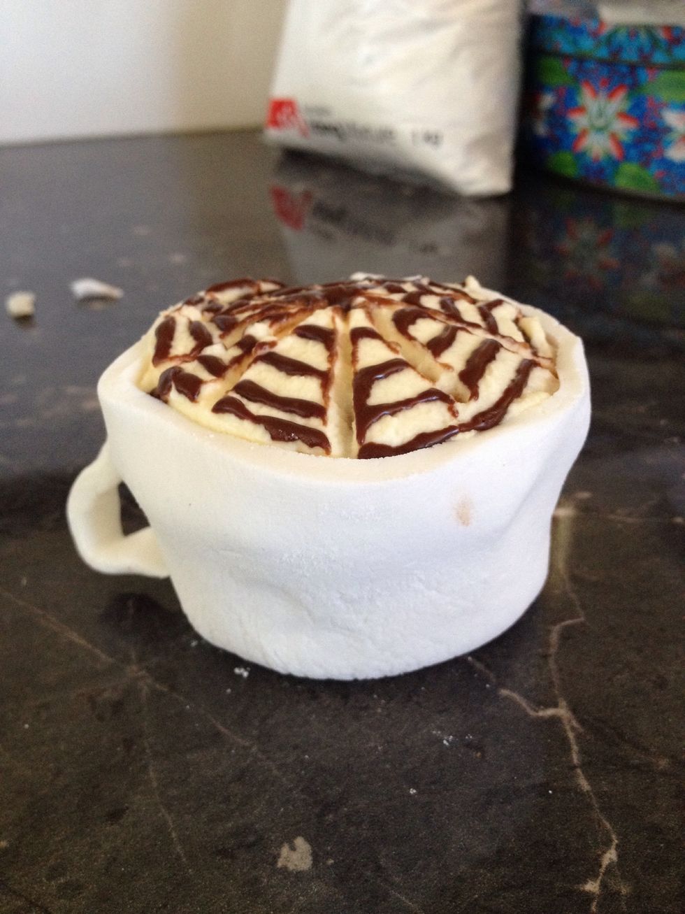 Stick it to the side of the cup.