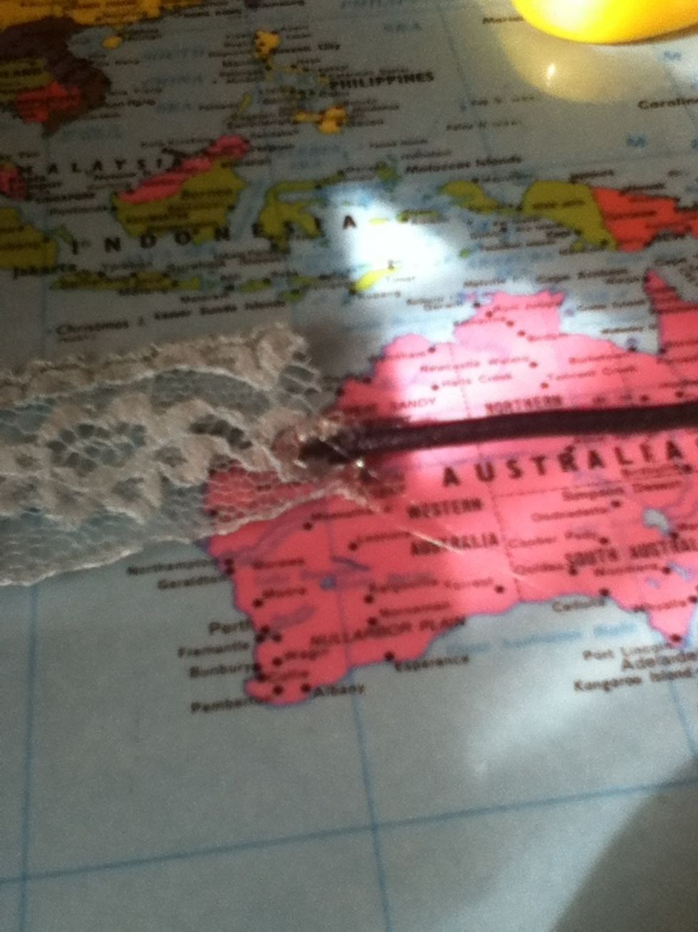 Stick one end of the hair elastic in it