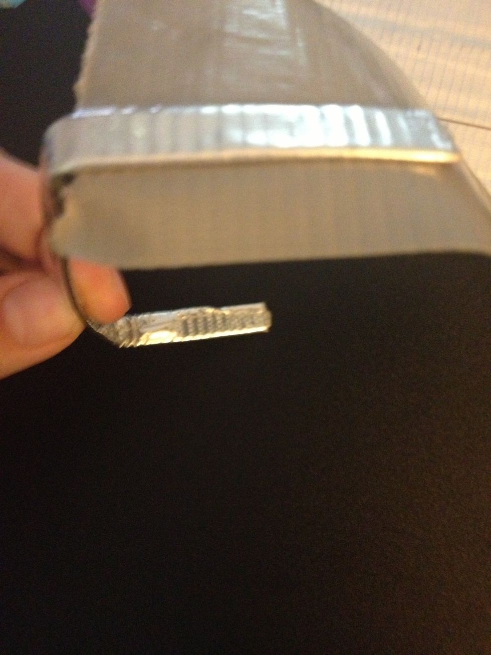 Stick one of the folded pieces of the hook onto the strip of duct tape.