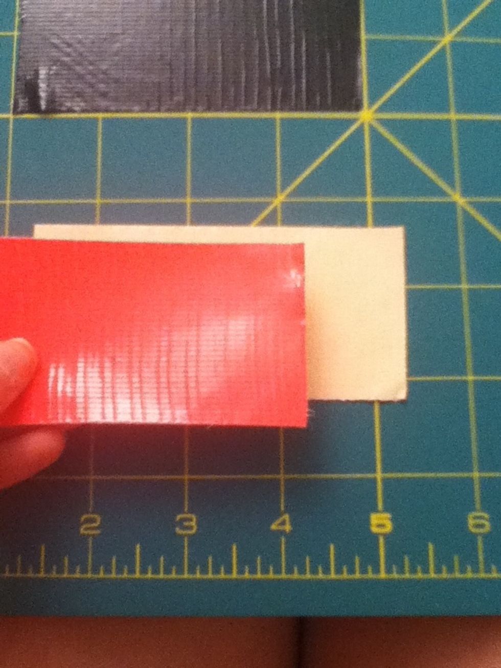 Stick one pink piece on top of the other.