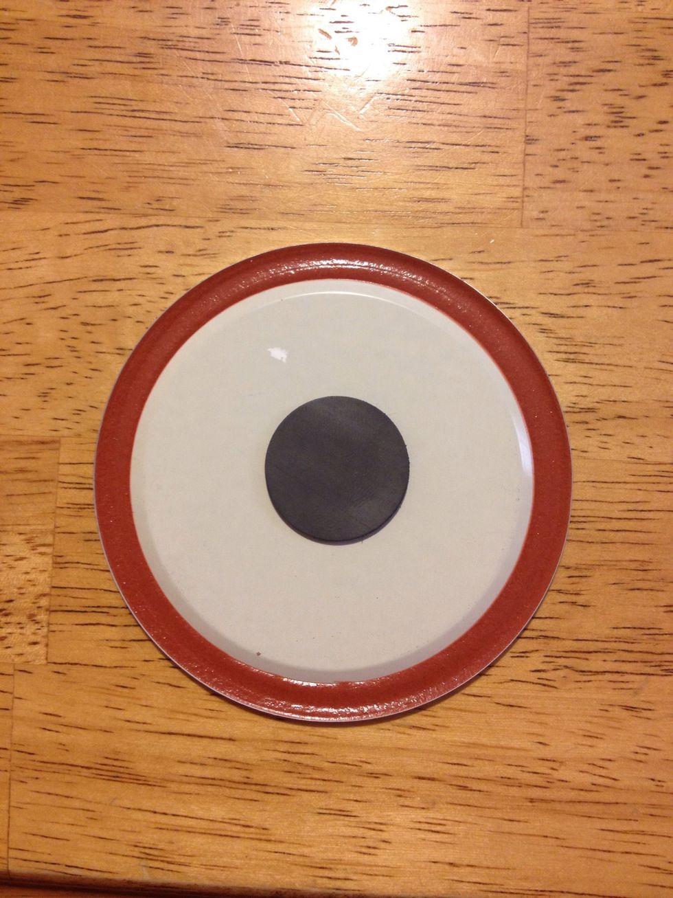Stick or glue your magnet to the underside of the lid.
