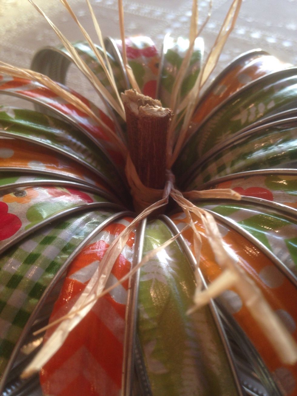 Stick stems in middle of rings. You can use hot glue to permanently set stem.