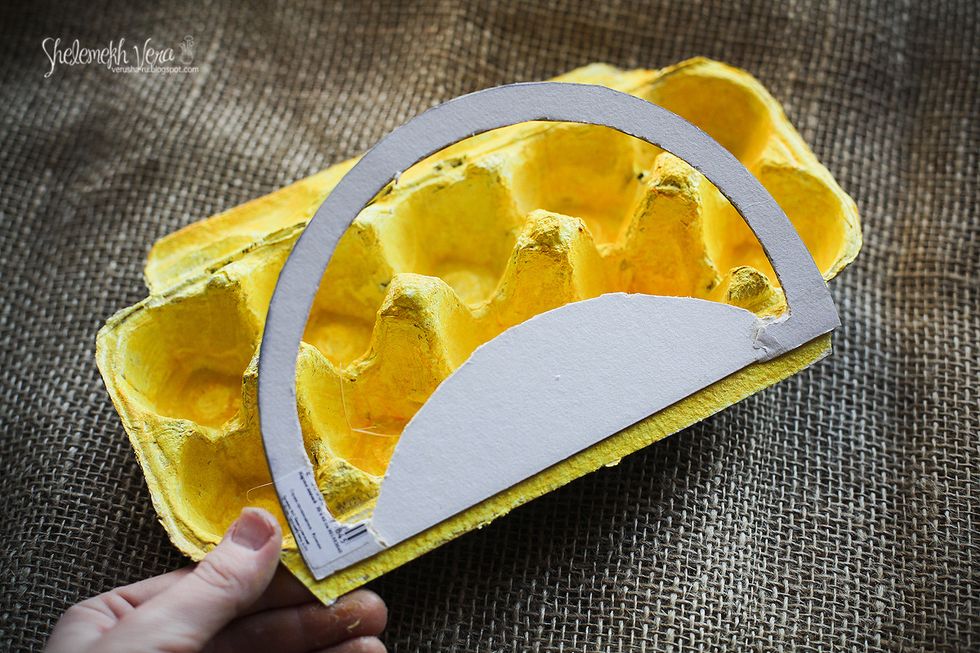 Stick the arch to the back side of the container