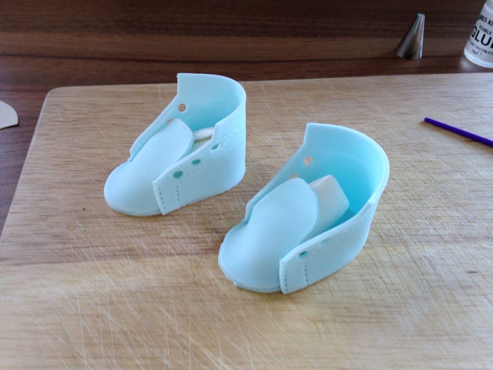 Stick the body of the shoe to the sole with a little sugar glue