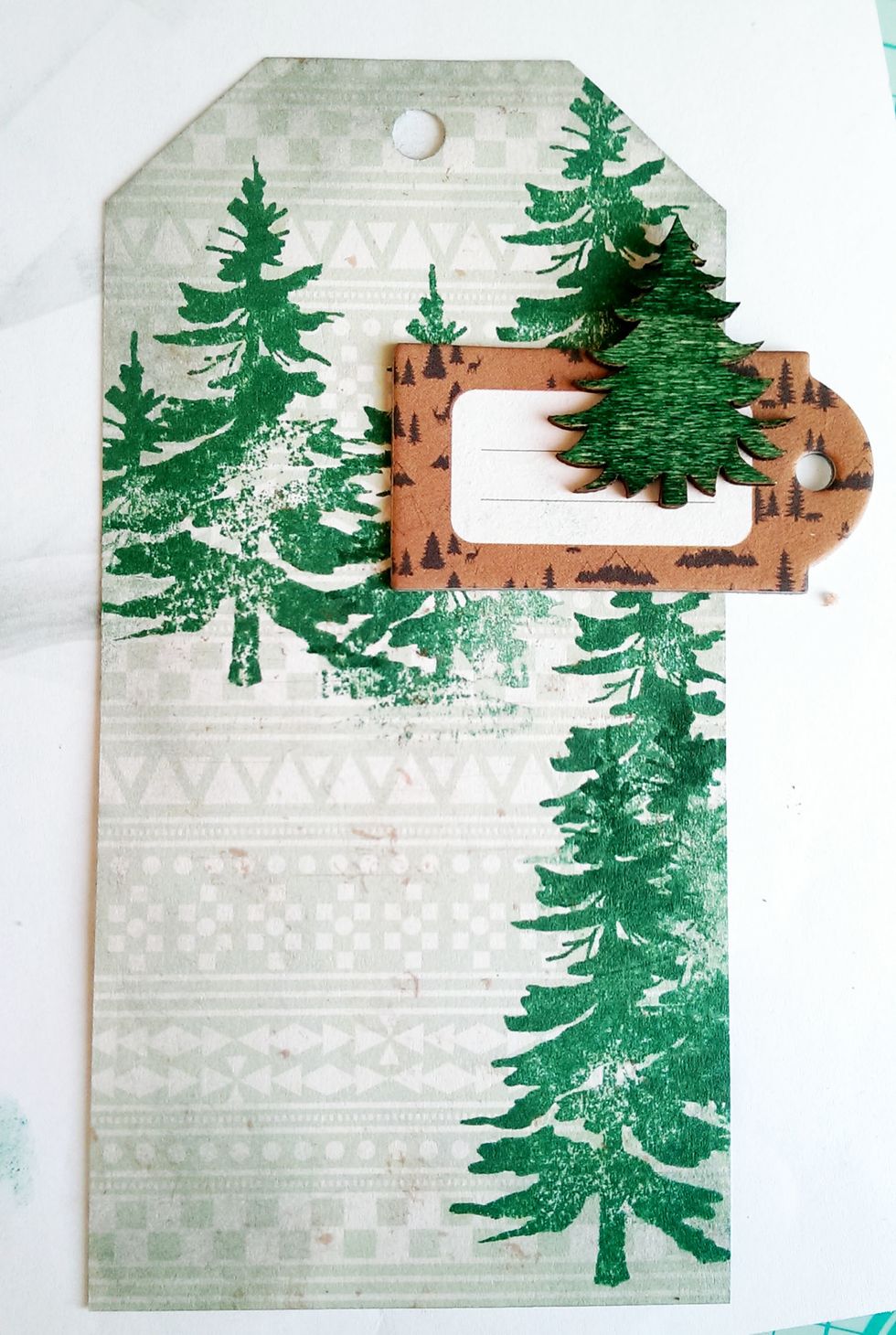 Stick the Brown tag to the top right, and then secure the Wood Tree on top of it, as in the picture.