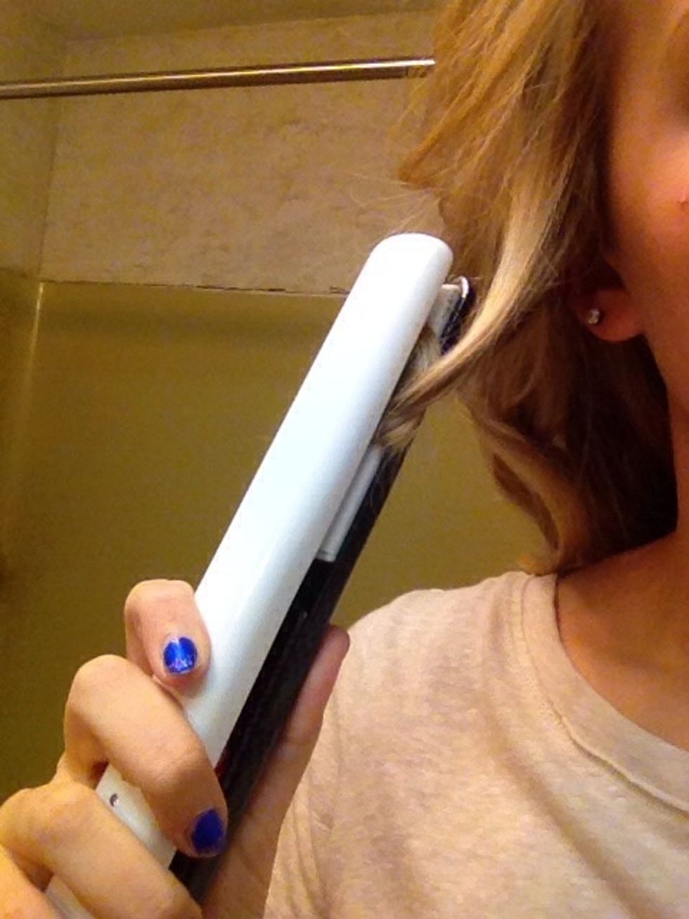 Stick the curled up hair in the flat iron and hold for 8-12 seconds.
