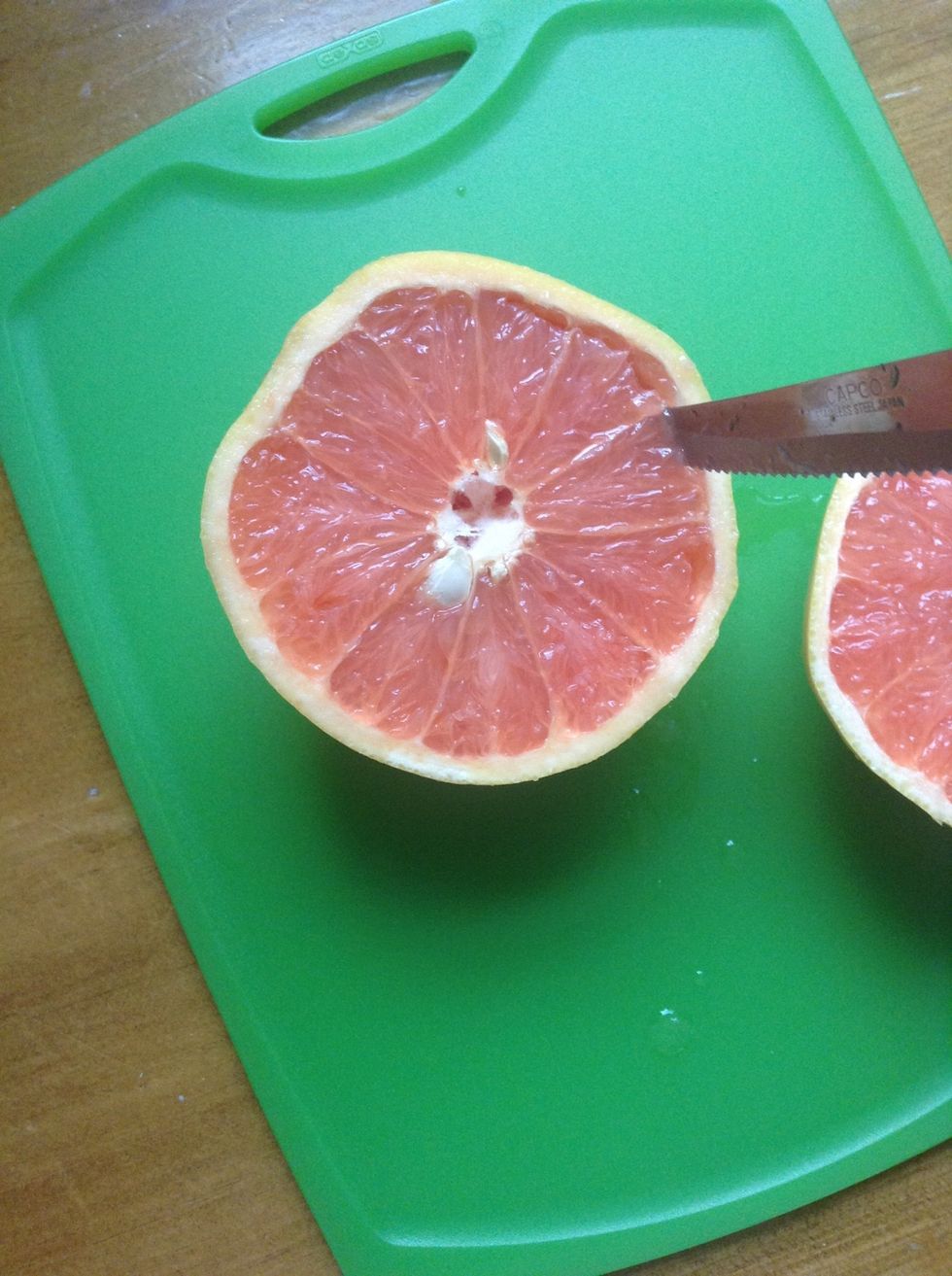 Stick the end if the knife on the edge, close to the peel, and turn your grapefruit, cutting all the way around.