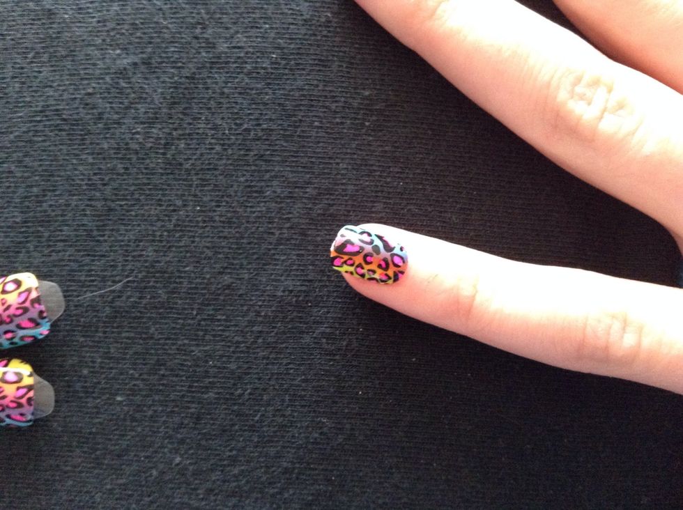 Stick the fake nail to your natural nail.