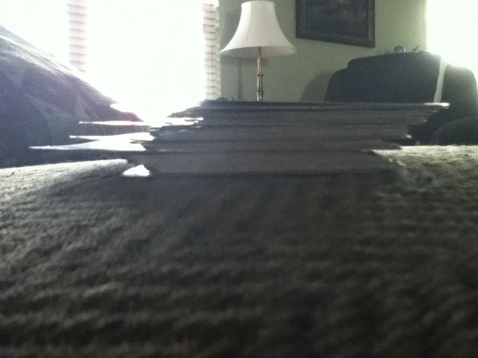 Stick the first card (called the robber ) close to the bottom and then put the rest like shown.