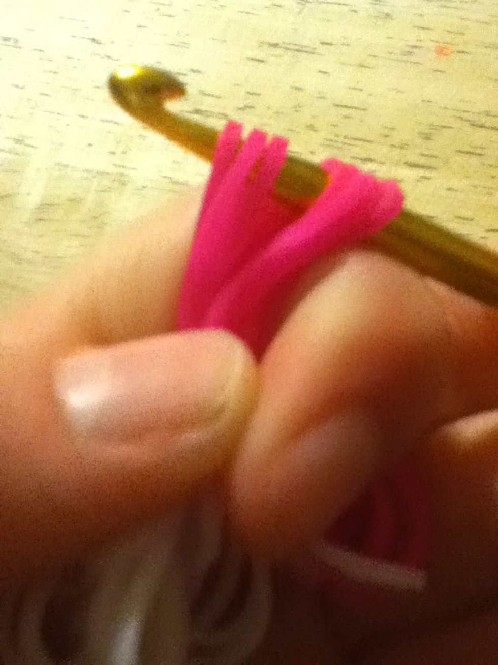 Stick the hook through a couple of bands.