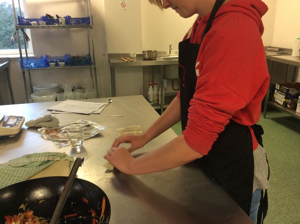 Stick the last edge in using a dab of water