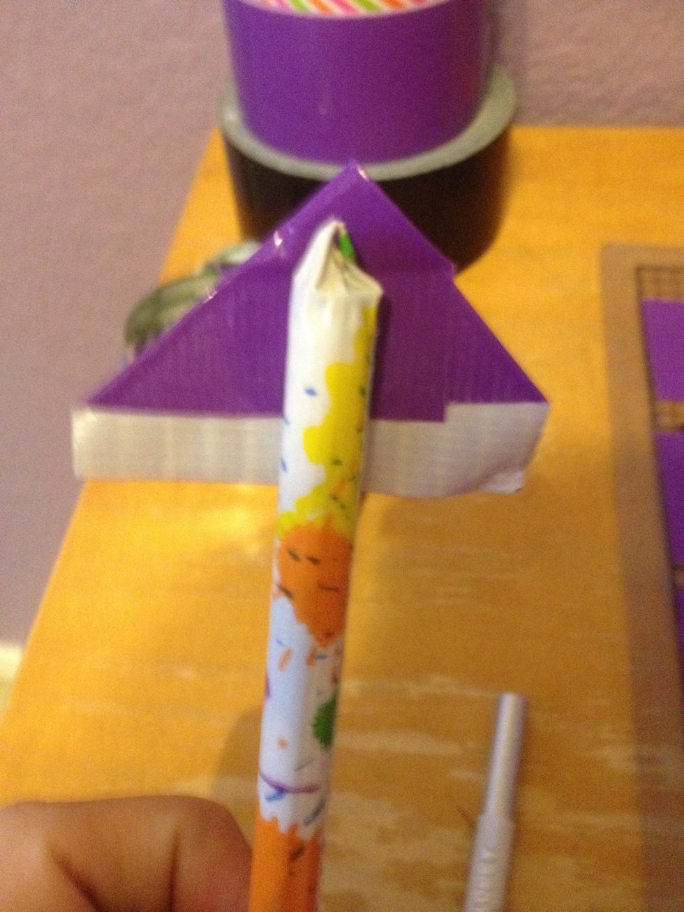 Stick the left over sticky ness and put it on the pen. Then wrap it around