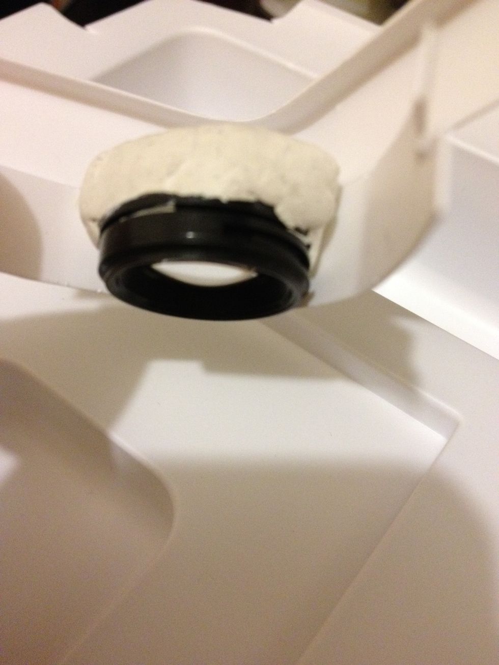 Stick the lens to the 'holder' around the corner. Try it on your phone and make sure the lens sit right on the camera.