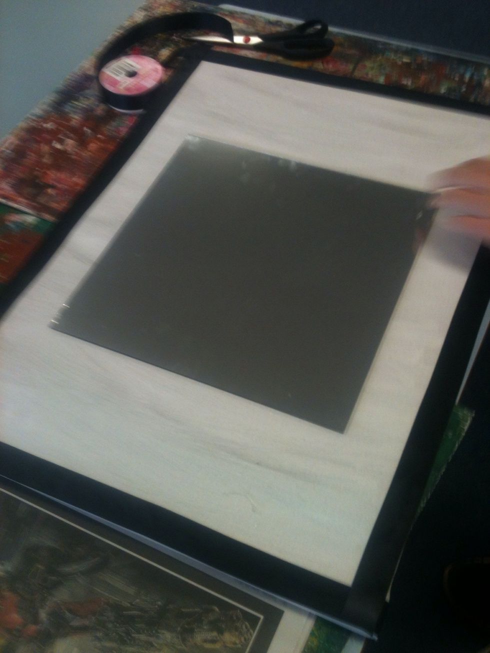 Stick the mirror on any way you like with the hot glue gun. Glue each corner