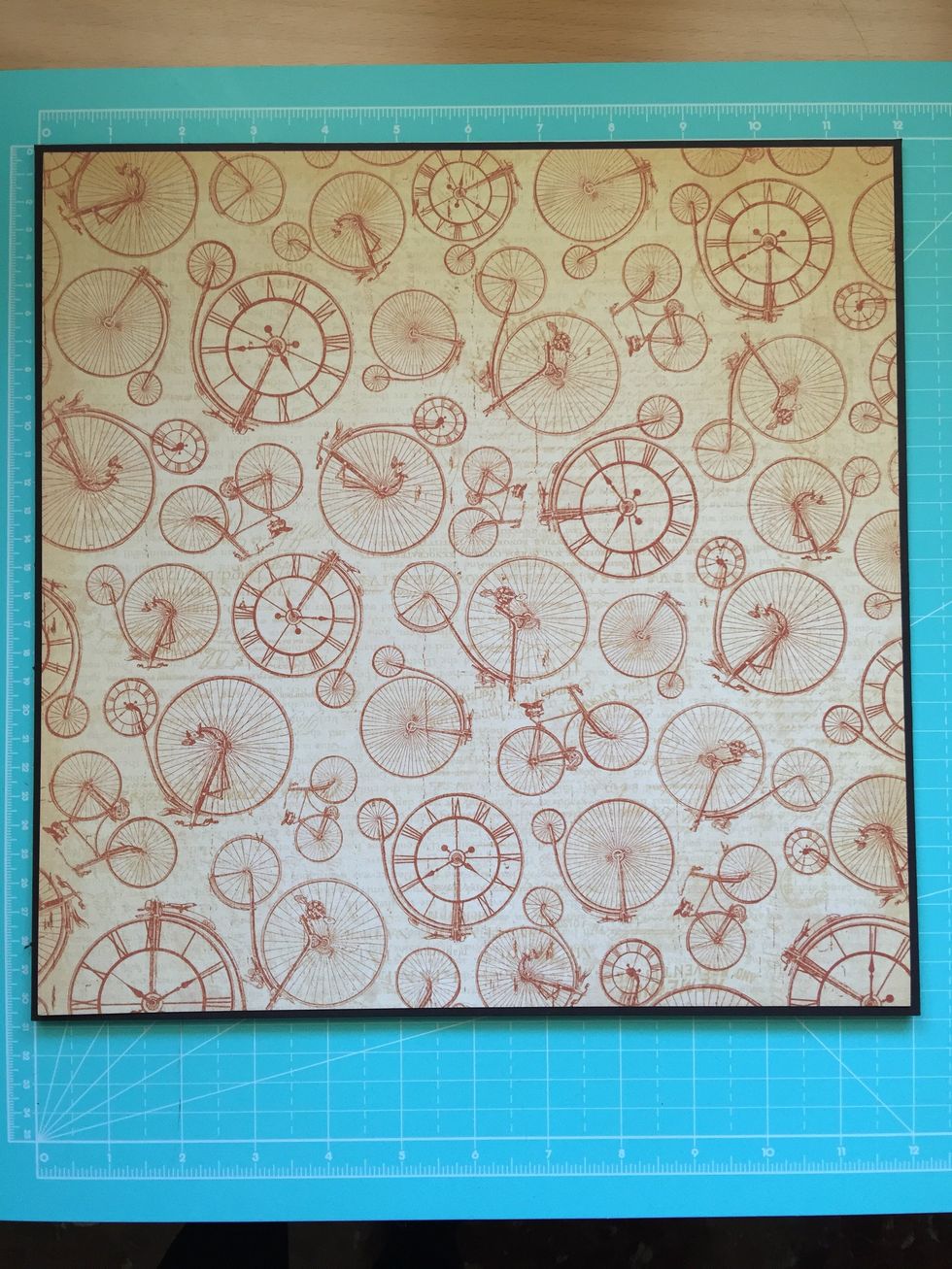 Stick the paper to the cardboard leaving a small margin.