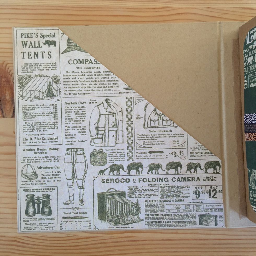 Stick the piece on the back of the cover.