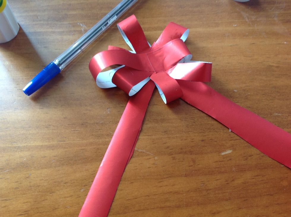 Stick the top of both strips under your ribbon.