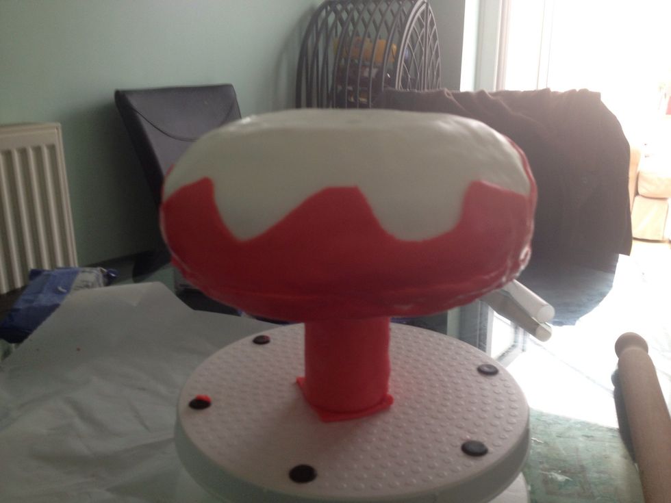 Stick the tube onto the cake