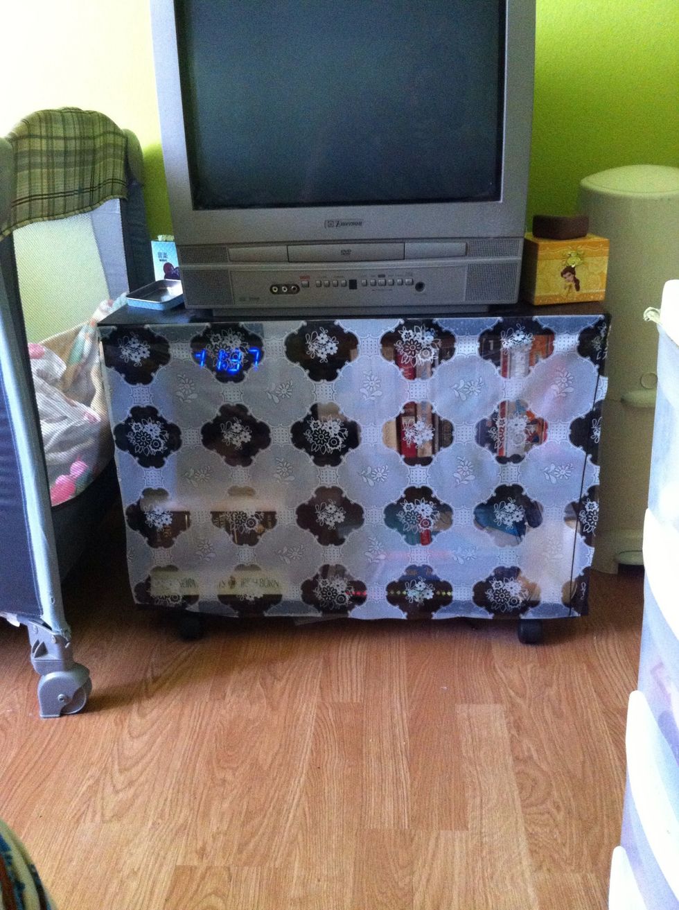 Stick the vinyl onto the bookshelf. The Velcro strips should align and do its thing. The vinyl keeps baby from tossing my books and DVDs around and the Velcro gives me access to my things. :)