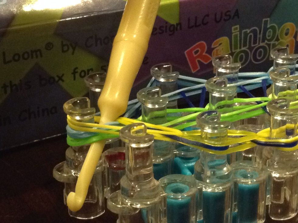 Stick your hook through the rubber bands