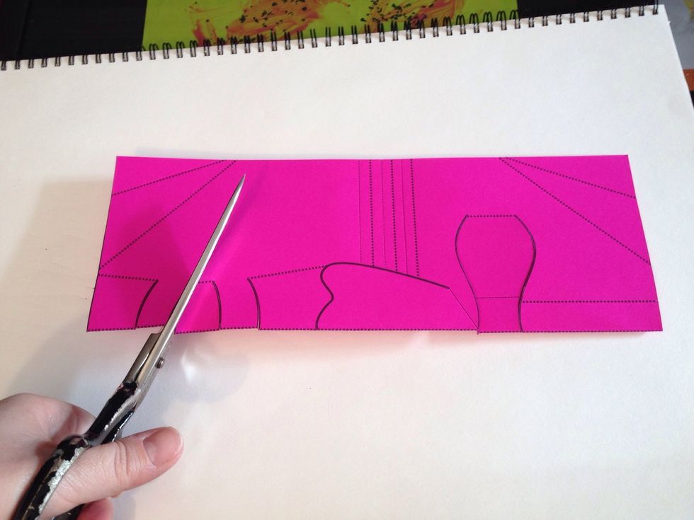 Still folded, cut along the solid lines.