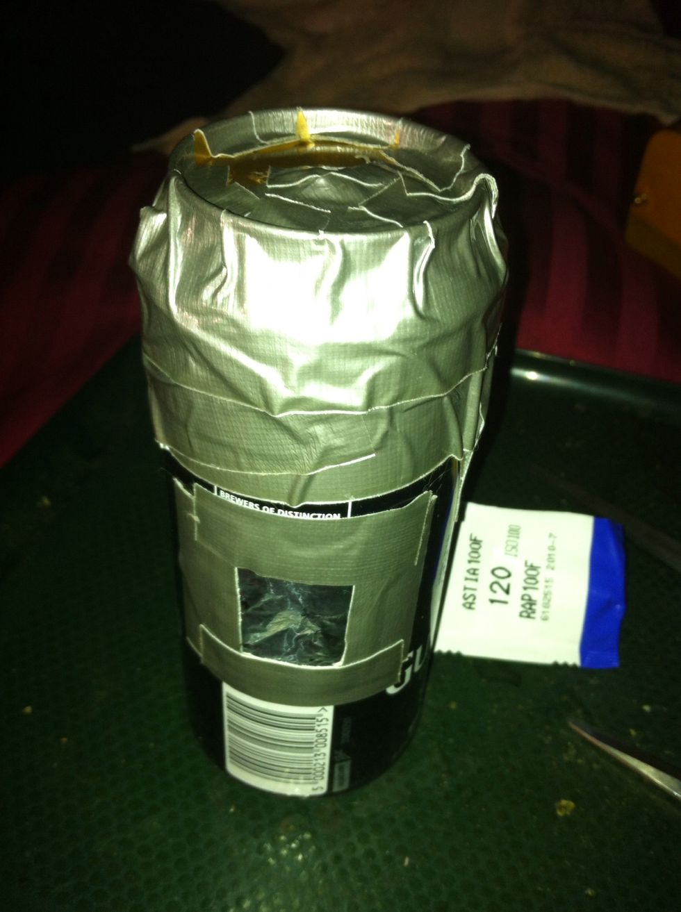 Still in the dark!! Tape the lid to the rest of the can. The seal it up,