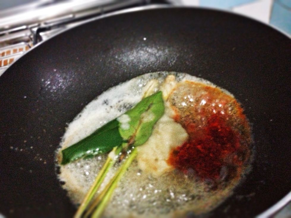Still use the same oil. Saute the blended spices, 2 bay leaves and 2 stalks of crushed lemongrass. Saute for about 2 mnts or slightly thickened.