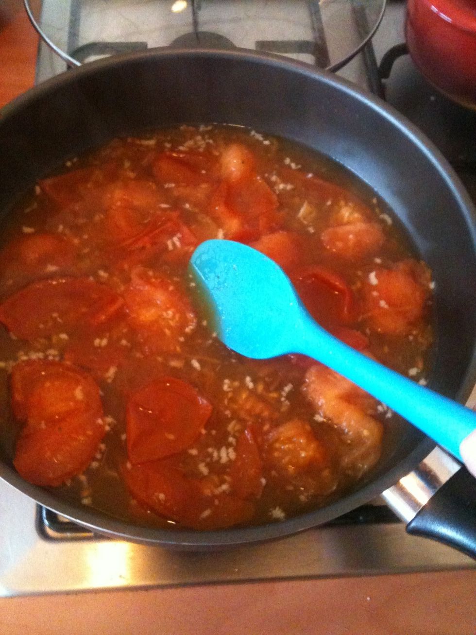 Stir and crush the tomatoes