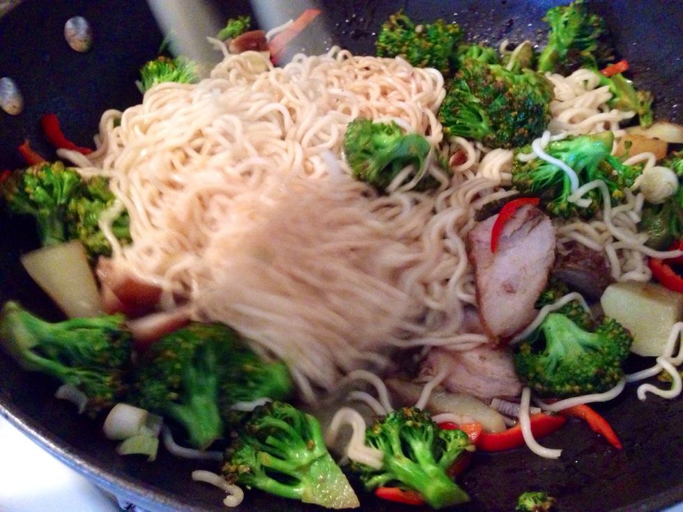 Stir and mix it all into the work. Add soy sauce, fish sauce, salt, sesame oil. Cook and stir fry over high heat.