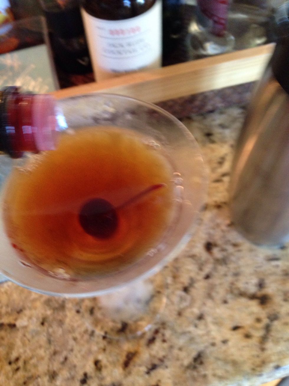 Stir and pour the mix into the frosted cocktail glass. Top with a single dash of bitters. Serve immediately. Enjoy the best Manhattan.