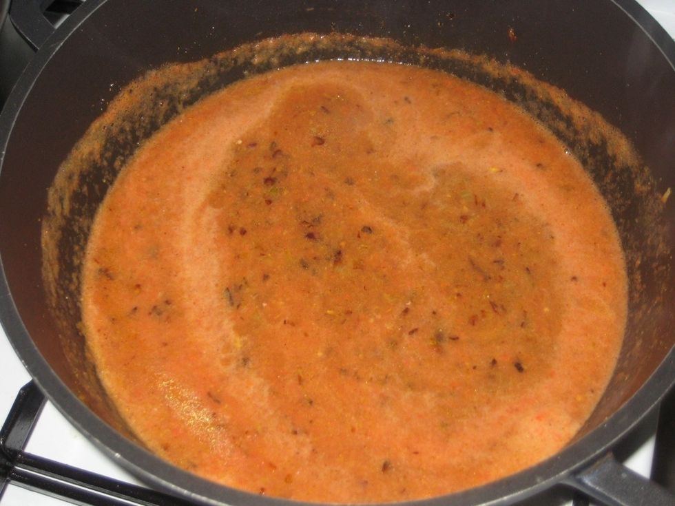 Stir and rinse off the tomato from the blender with little water and pour into the pan.