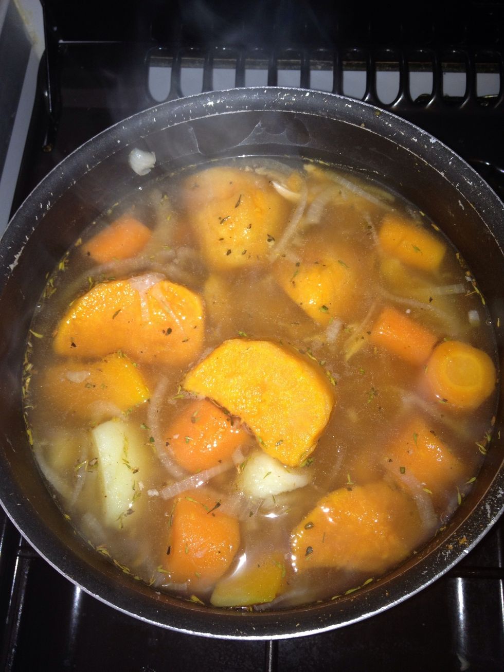 Stir, and then cover (not completely). Keep on medium heat. Check every so often to ensure that the potatoes, carrots, and butternut squash aren't becoming too soft. Once cooked, turn heat off.