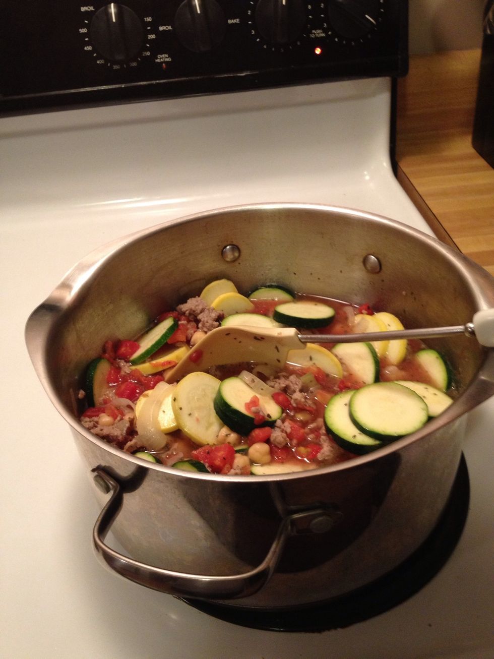 Stir and turn the heat up a little. Bring to a boil.