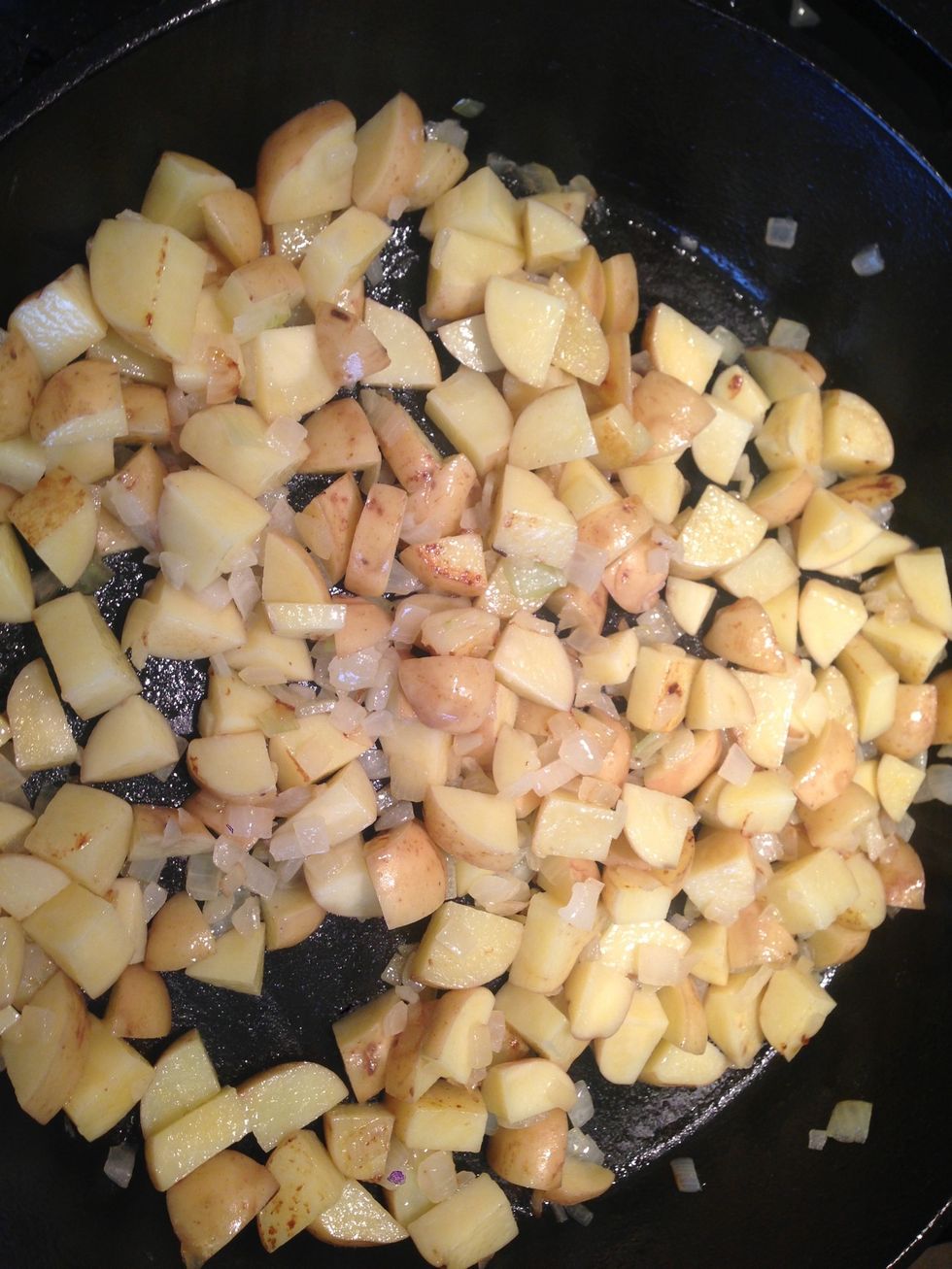 Stir every once in a while so your onions don't burn. And so all the potatoes get nice and crispy.