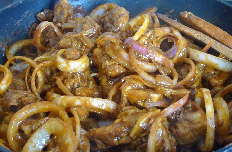 Stir fry until onion rings are well mixed into the curry mixture.