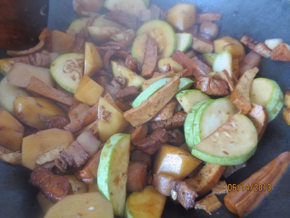 Stir fry until potatoes are soft