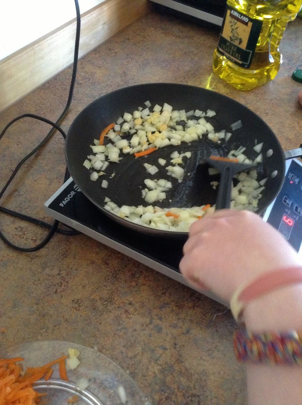 Stir garlic and onions for two minutes