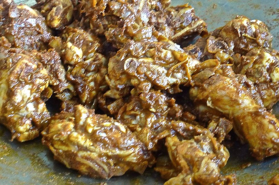 Stir gently until chicken is well coated with the curry powder. Add hot water. Cover and simmer over medium heat until liquid dries and the chicken becomes tender.