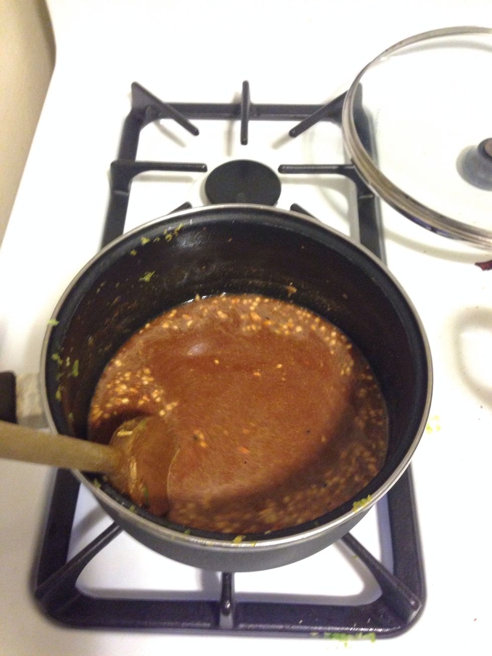 Stir. I added in 1 tbsp of minced onions and garlic to the mixture as well. Keep stirring until the sauce bowls. Once it bowls, turn in low heat. If the sauce is runny, add a bit more flour.