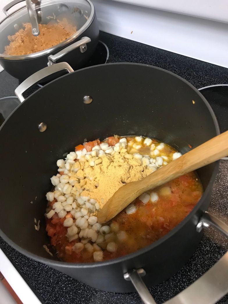 https://guides.brit.co/media-library/stir-in-1-cup-water-hominy-and-1-tablespoon-knorr-u00ae-shrimp-bouillon-and-bring-to-a-boil-cook-uncovered-over-medium-high.jpg?id=23637917&width=784&quality=85