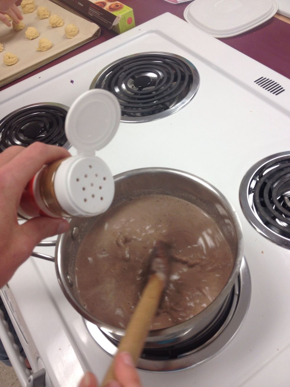 Stir in 2 Tbs of sugar, 1 Tbs unsalted butter and a pinch of cinnamon. Return to a simmer and cook, stirring until thickened and smooth, about 5 minutes. Remove from heat and let stand a minute or two