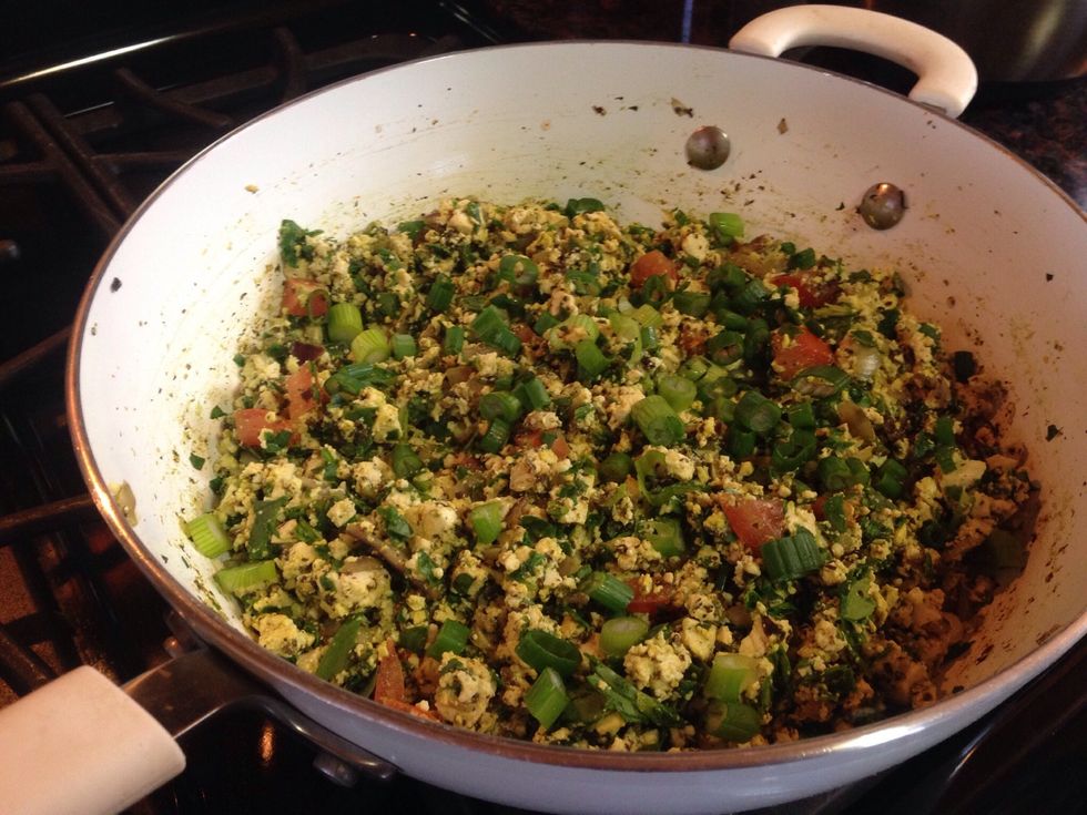 Stir in chopped tofu, then spinach, then green onions (if using). Shown here in Pampered Chef's 11" Ceramic Skillet.