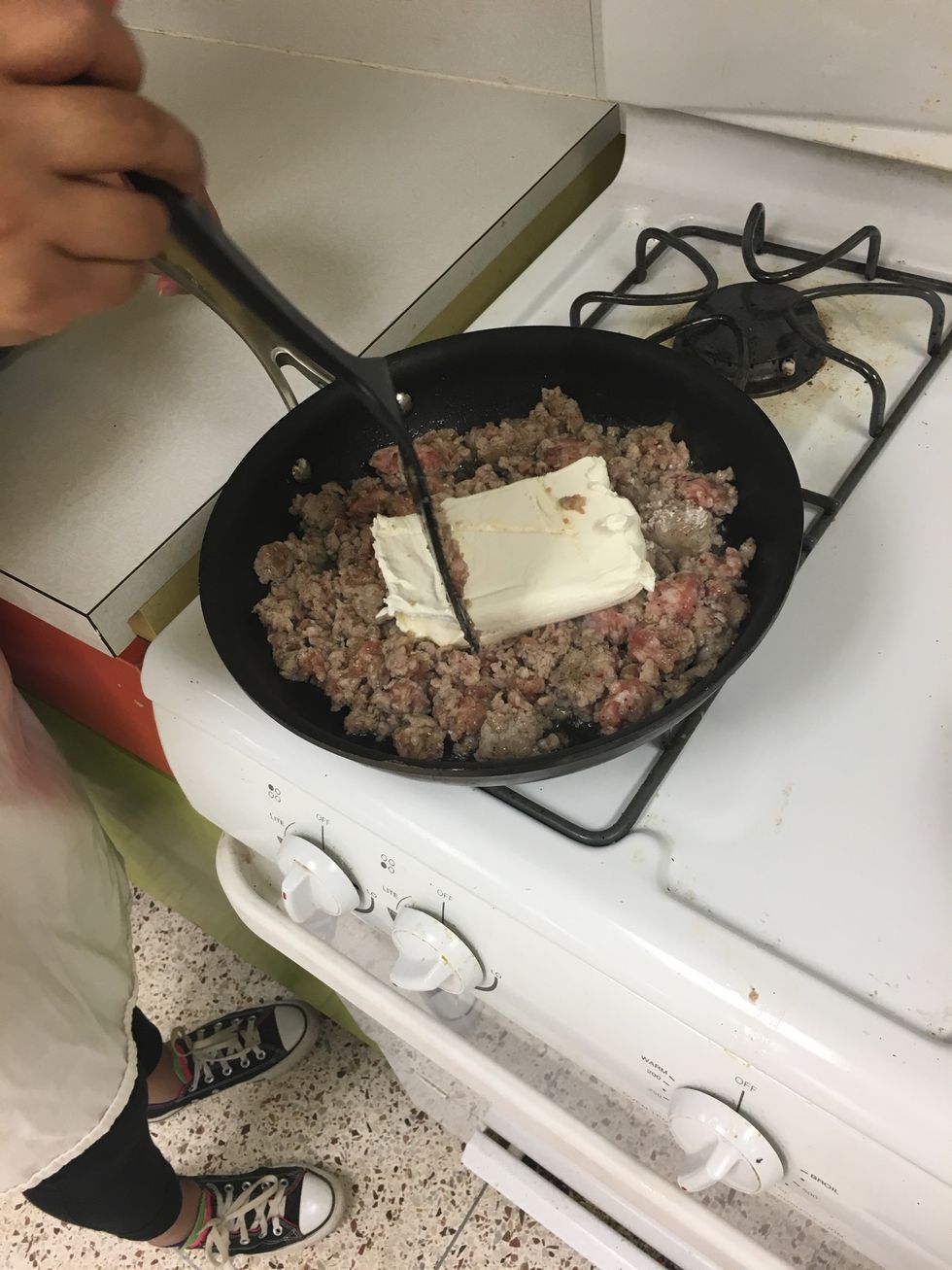 stir in cream cheese into the cooked sausage