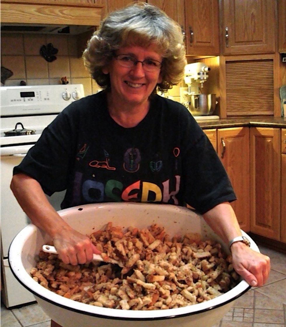 Stir in melted butter, meats, juice from cooking meats, celery & onion and seasonings. It SMELLS SO GOOD! You can sample it now too! Place in airtight containers & refrigerate along with thawed turkey