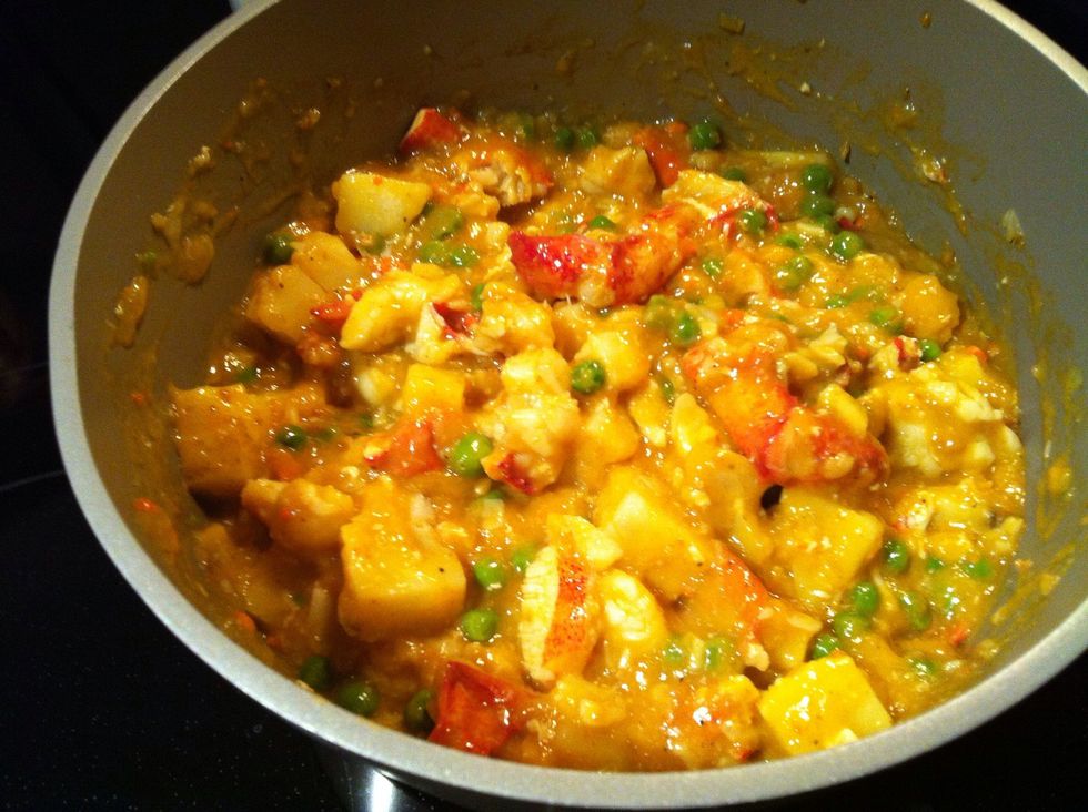 Stir in potatoes, peas, mix thoroughly, add chicken stock (I used lobster bisque :P) AND a little water